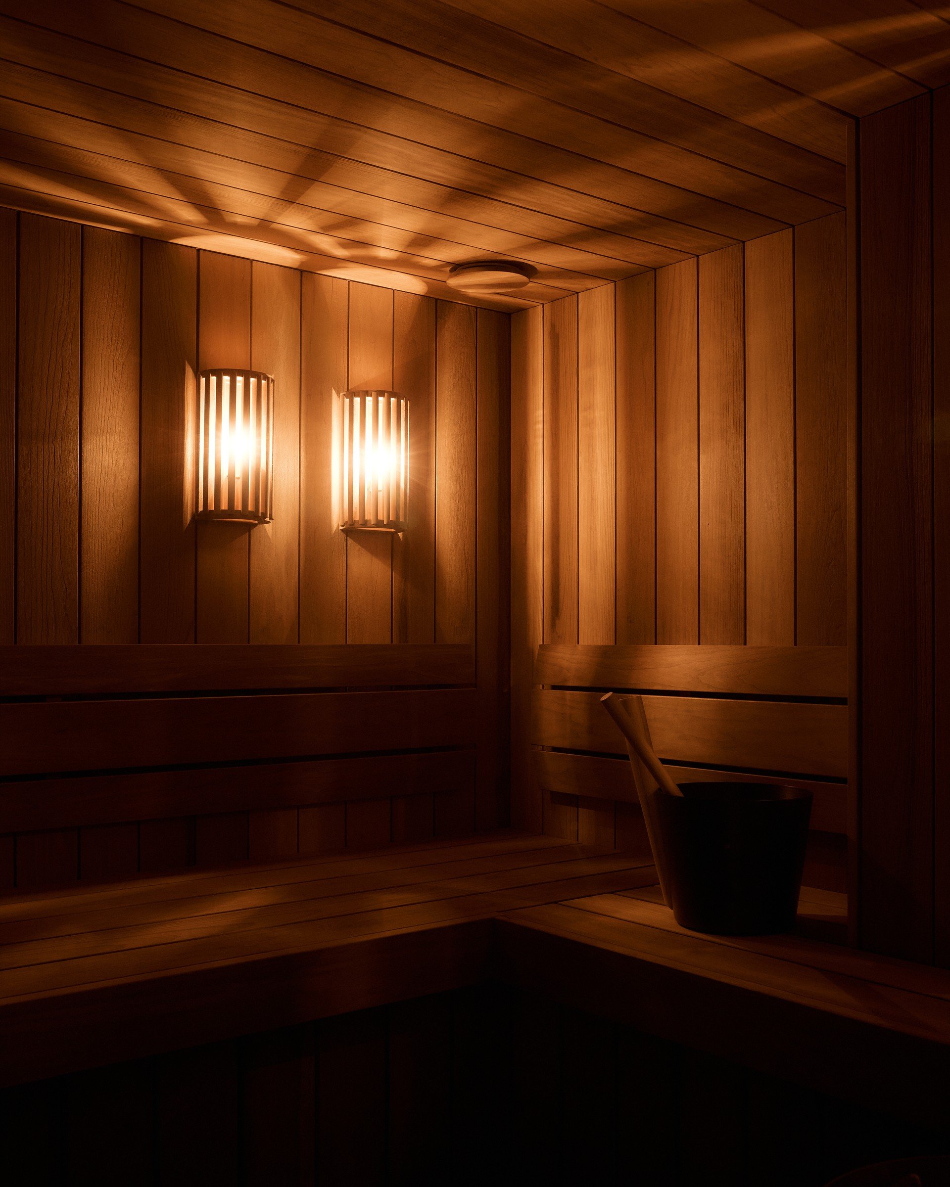 Timber-lined sauna with soft lighting