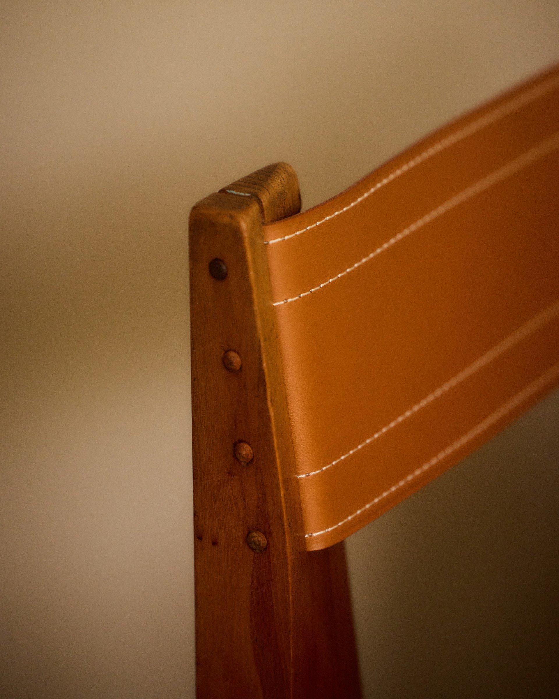 Detail of a vintage leather and timber chair